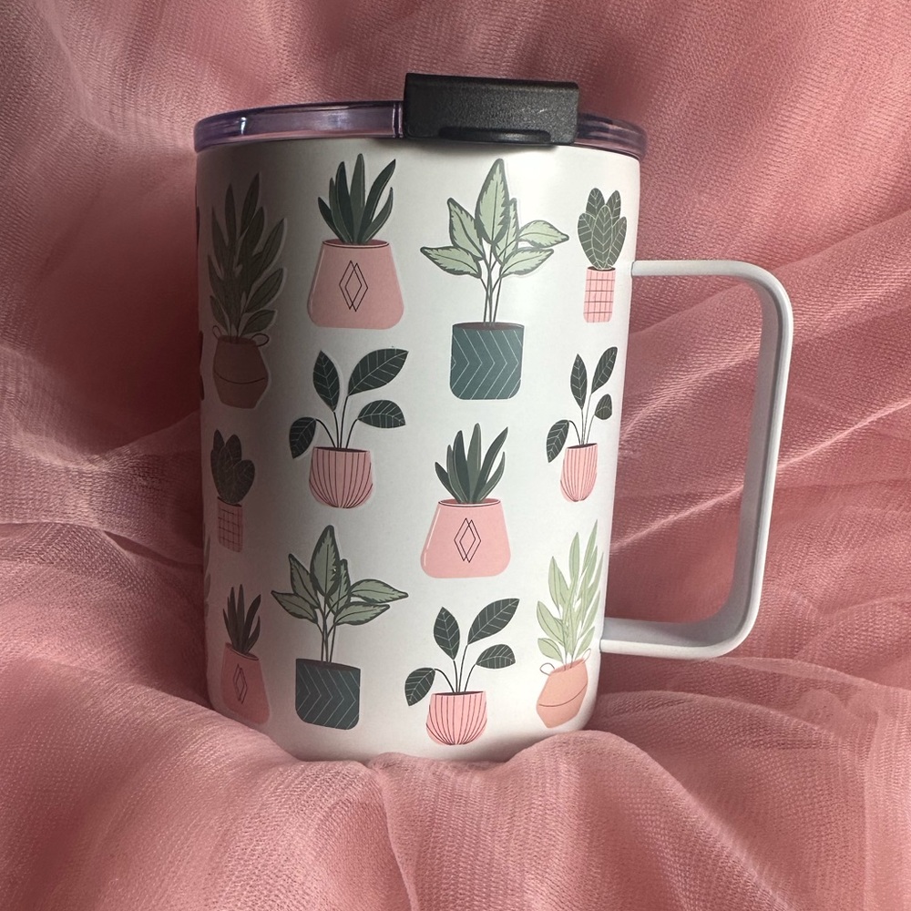 Stainless steel 14 ounce travel mug. White, pink and green with Plant Pot Design